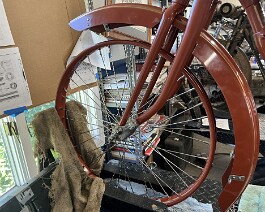 Front wheel and hub fitted to front forks.